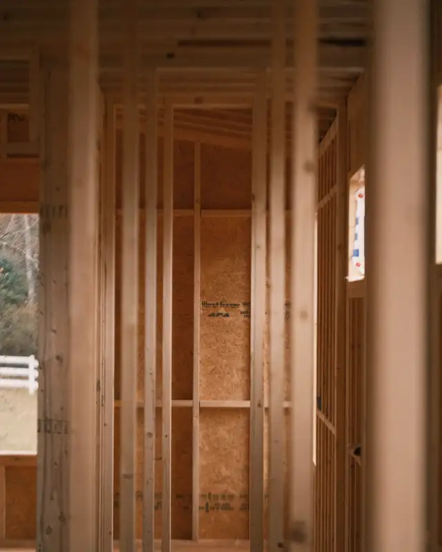 Tall interior stud walls in a house under construction
